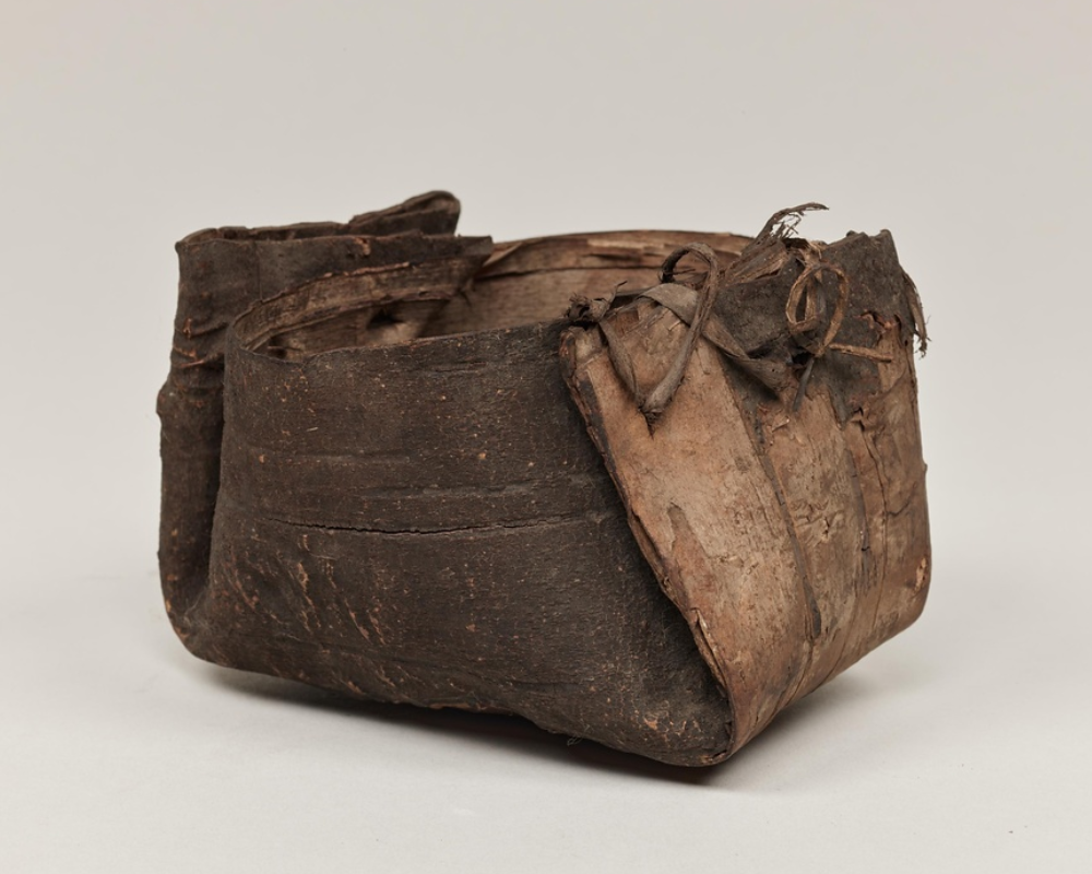 A ladle made from folded bark.