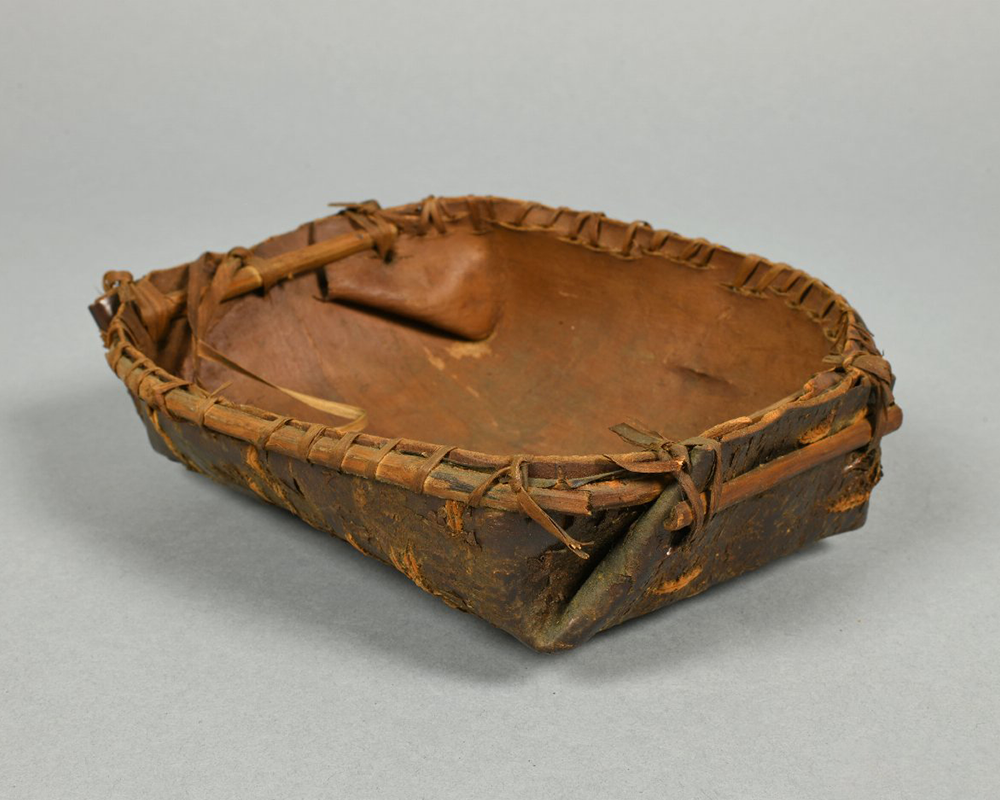 A cooking vessel made of cherry bark.