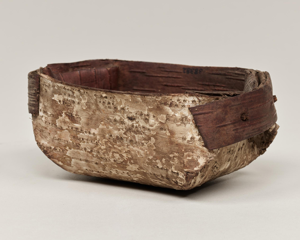 A container made of folded birch bark.