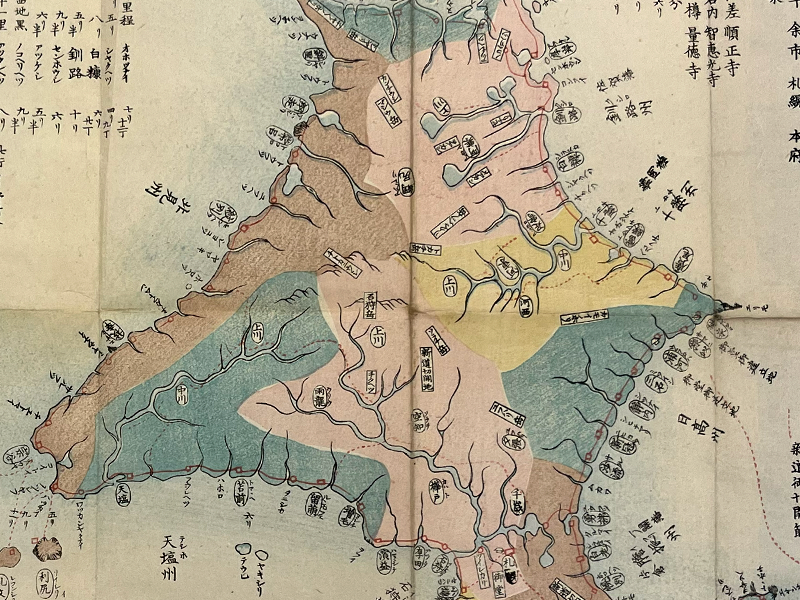 A segment of a printed map showing Hokkaido in multicolors.