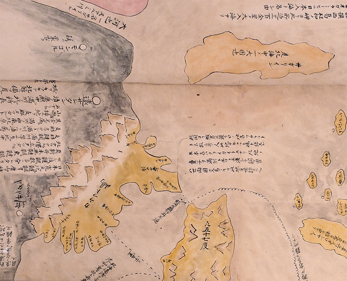 A closeup of Sakhalin on a hand painted map, with the island divided into two parts and in yellow. One part is an island and the other is attached to the mainland.